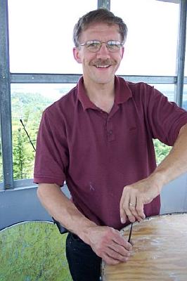 Volunteer Kevin MacBride installing new map table June 24th